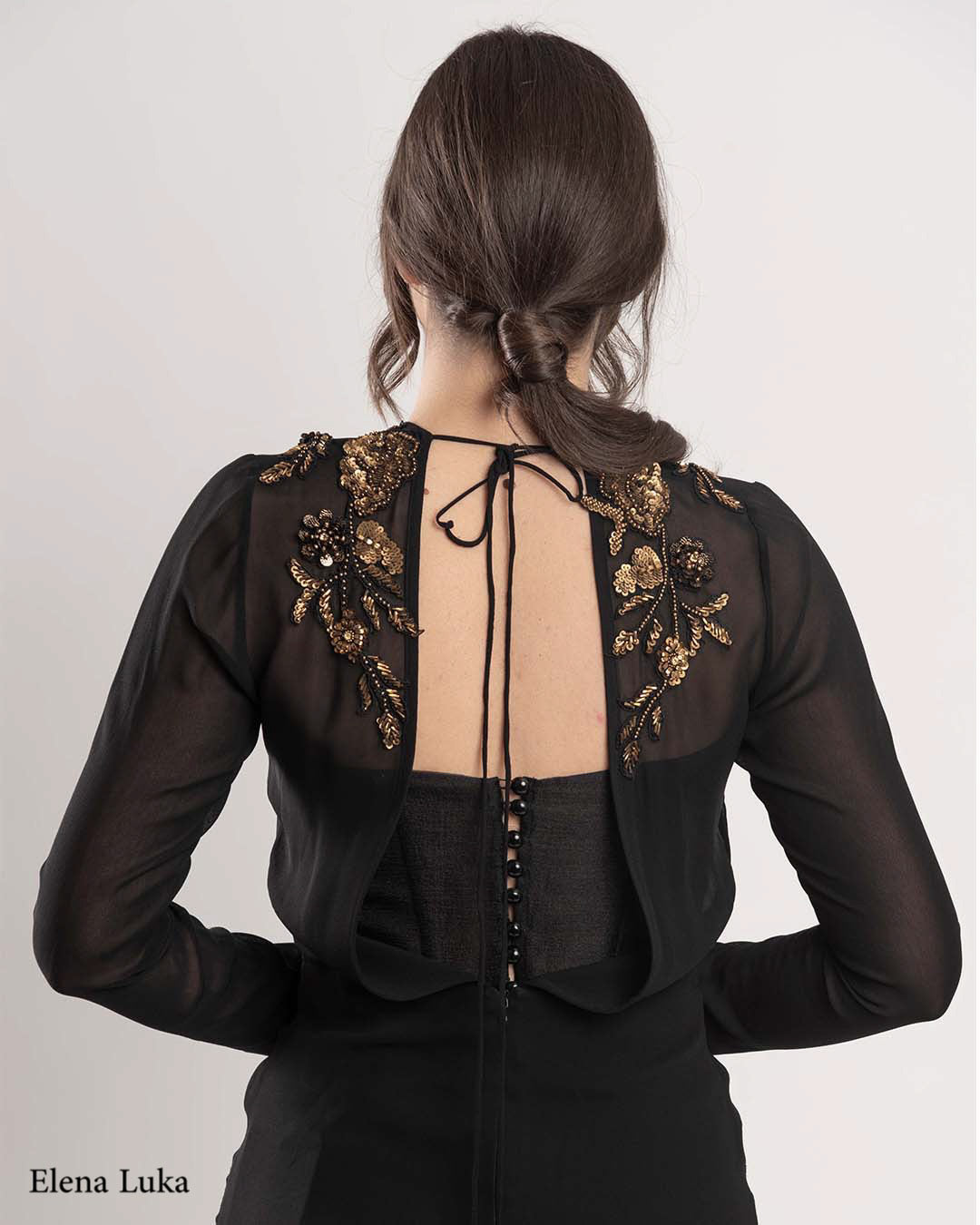 Black cocktail dress with gold lace